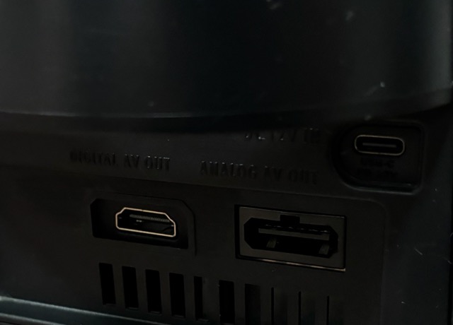 The Nintendo GameCube from before, but from its back side. What makes this picture special is that the power socket was replaced with a USB-C socket, and the Digital Out video socket was replaced with an HDMI socket.