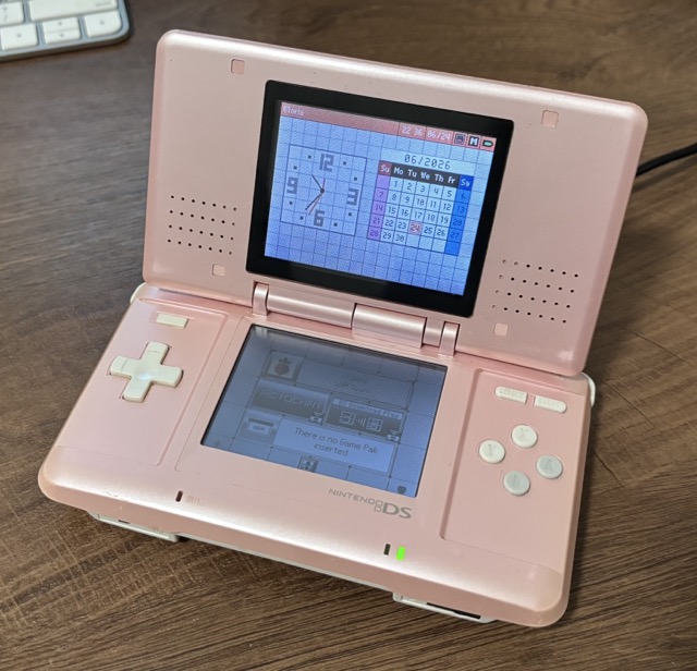 The same Nintendo DS as before, but opened up.